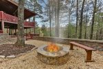 Fire pit with views at the side of the cabin